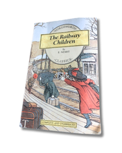 Load image into Gallery viewer, Book cover of 'The Railway Children' by E. Nesbit with illustrations of children on a railway platform. Available to purchase in New Zealand