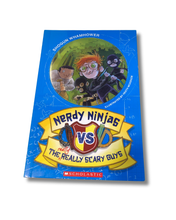 Load image into Gallery viewer, Book cover of 'Nerdy Ninjas vs. The Really Scary Guys' with colorful illustration on a blue background