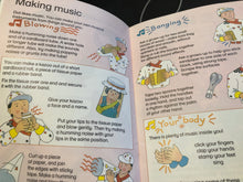 Load image into Gallery viewer, Open book with instructions on making music using everyday items, featuring illustrations of a child and musical instruments.