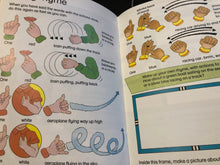 Load image into Gallery viewer, Open book with illustrations and text on hand movements and rhymes