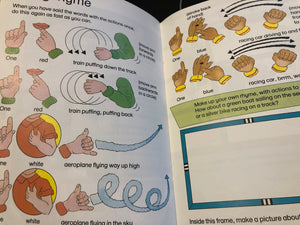 Open book with illustrations and text on hand movements and rhymes
