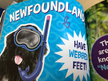 Load image into Gallery viewer, Children's book with a dog wearing goggles and text about Newfoundland dogs on a blue background.