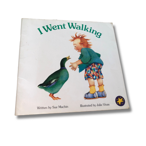 Book titled 'I Went Walking' with a child and duck illustration on a white background