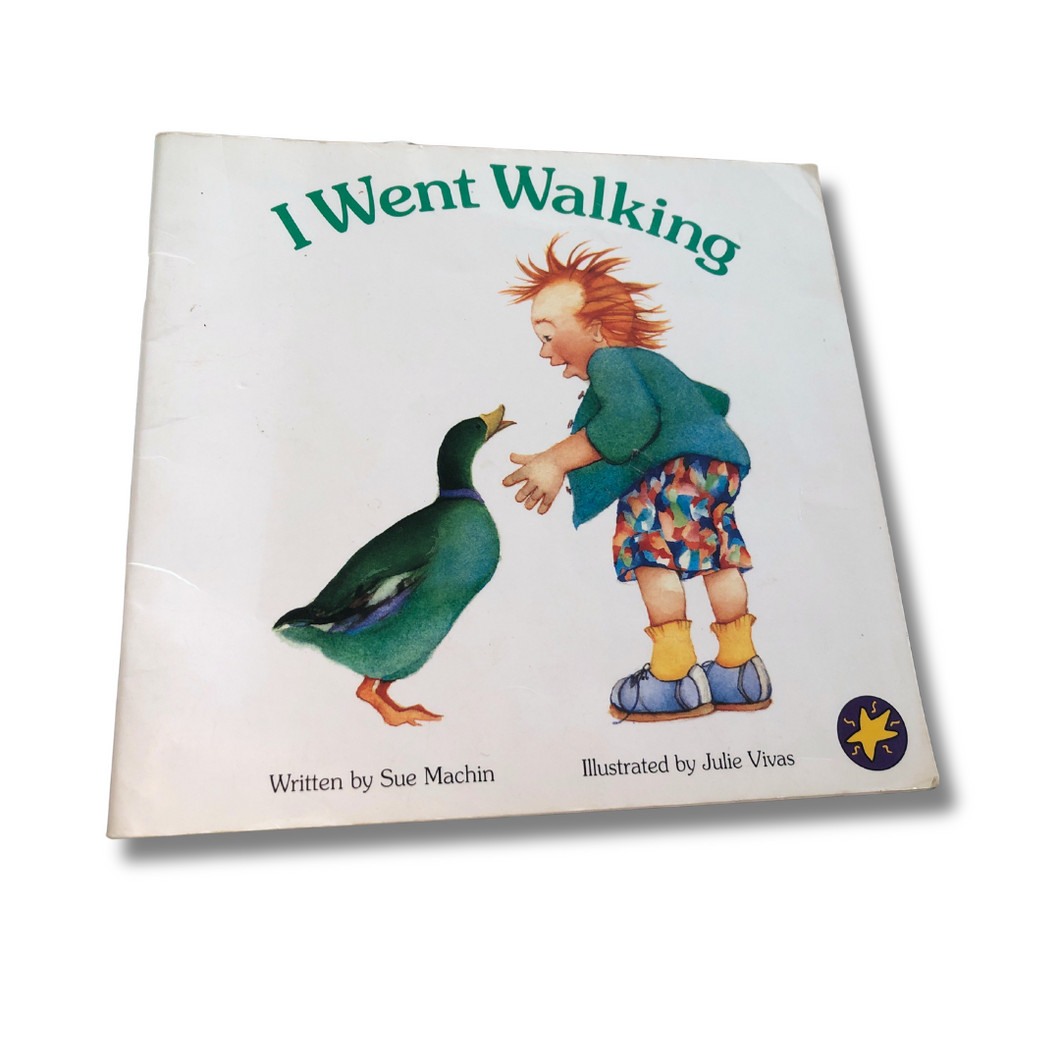 Book titled 'I Went Walking' with a child and duck illustration on a white background
