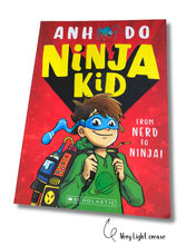 Load image into Gallery viewer, Book cover of &#39;Ninja Kid&#39; with a child in a green outfit and blue mask on a red background.